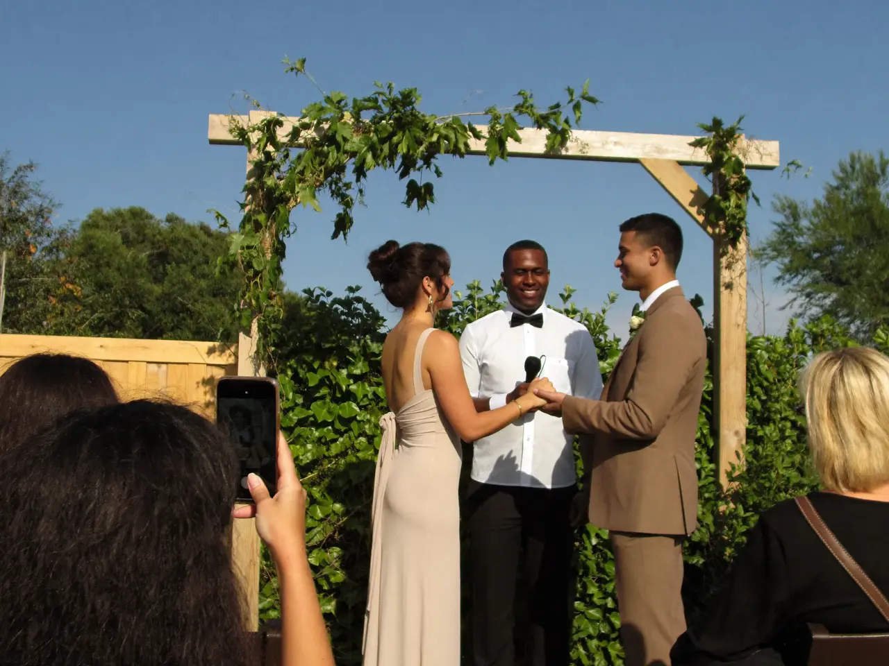 Vows under the wooden arch
