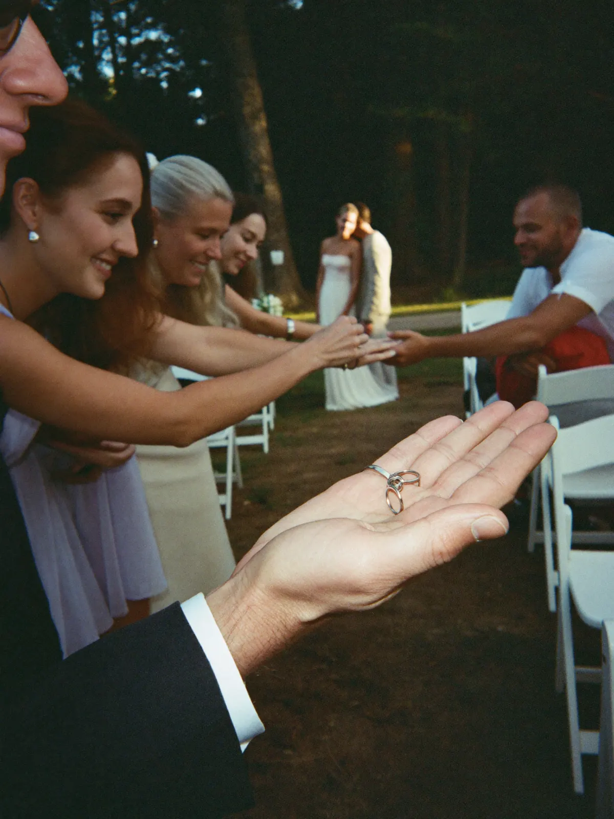 The rings passed hand to hand along the front row