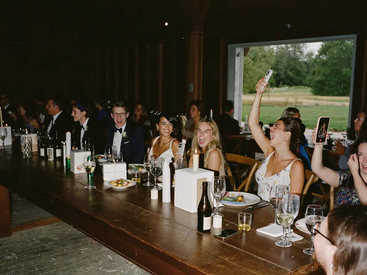 Guests laughing during the toasts